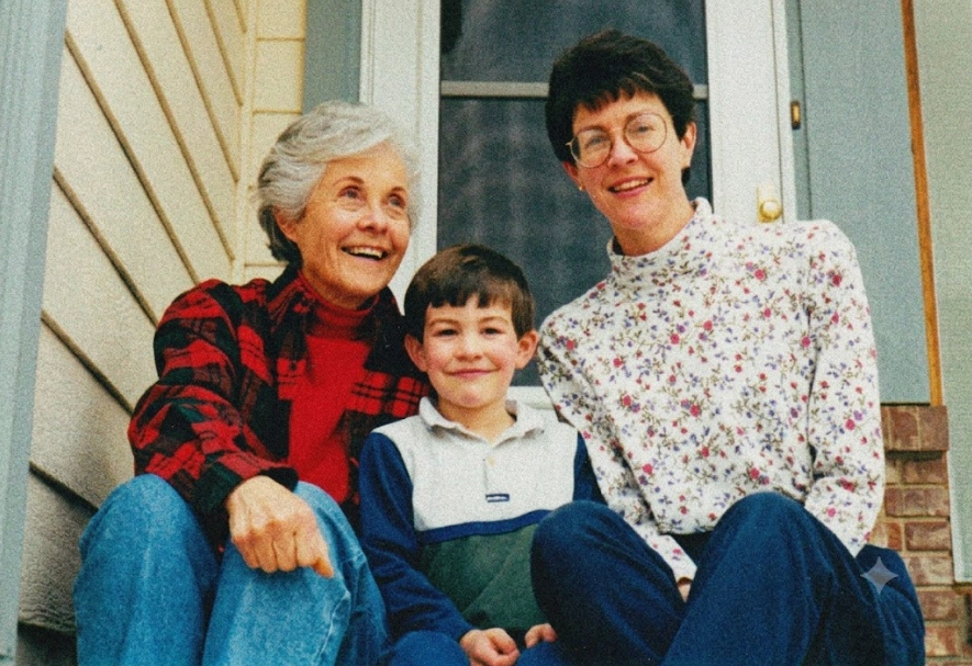 Original portrait of two women and a young boy seated together on a front porch.
